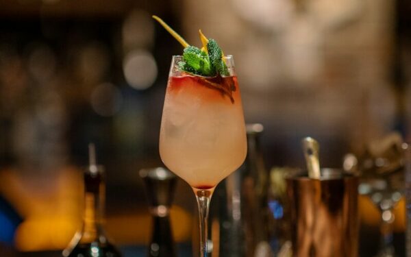 a drink sitting on top of a wooden table