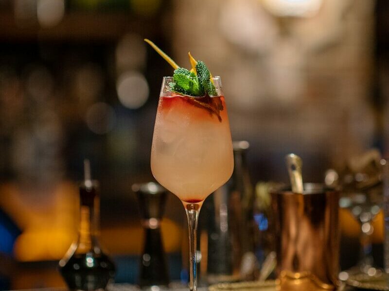 a drink sitting on top of a wooden table