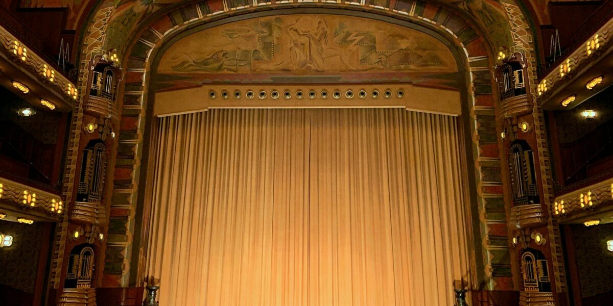 a large ornate theater with a large stage