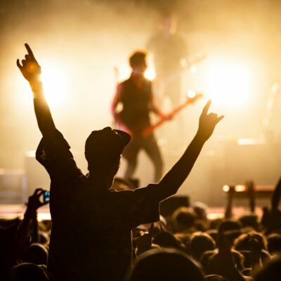 people watching band on the stage