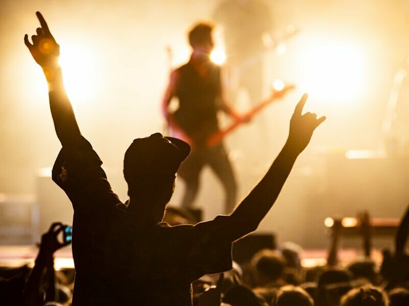 people watching band on the stage